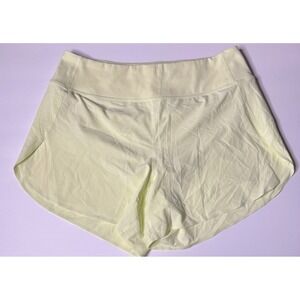 Athleta Run With It 4.5 inch Shorts Women Medium Light Yellow EUC Zipper Pocket
